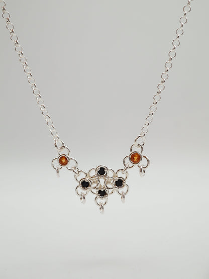 sterling silver TRAME necklace with blue and orange sapphires