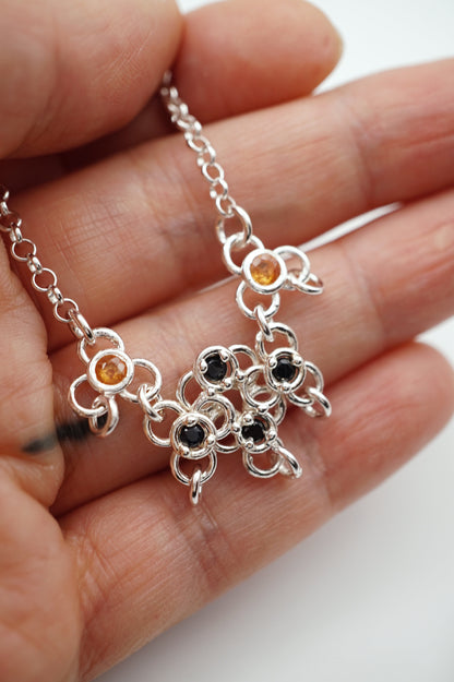 sterling silver TRAME necklace with blue and orange sapphires
