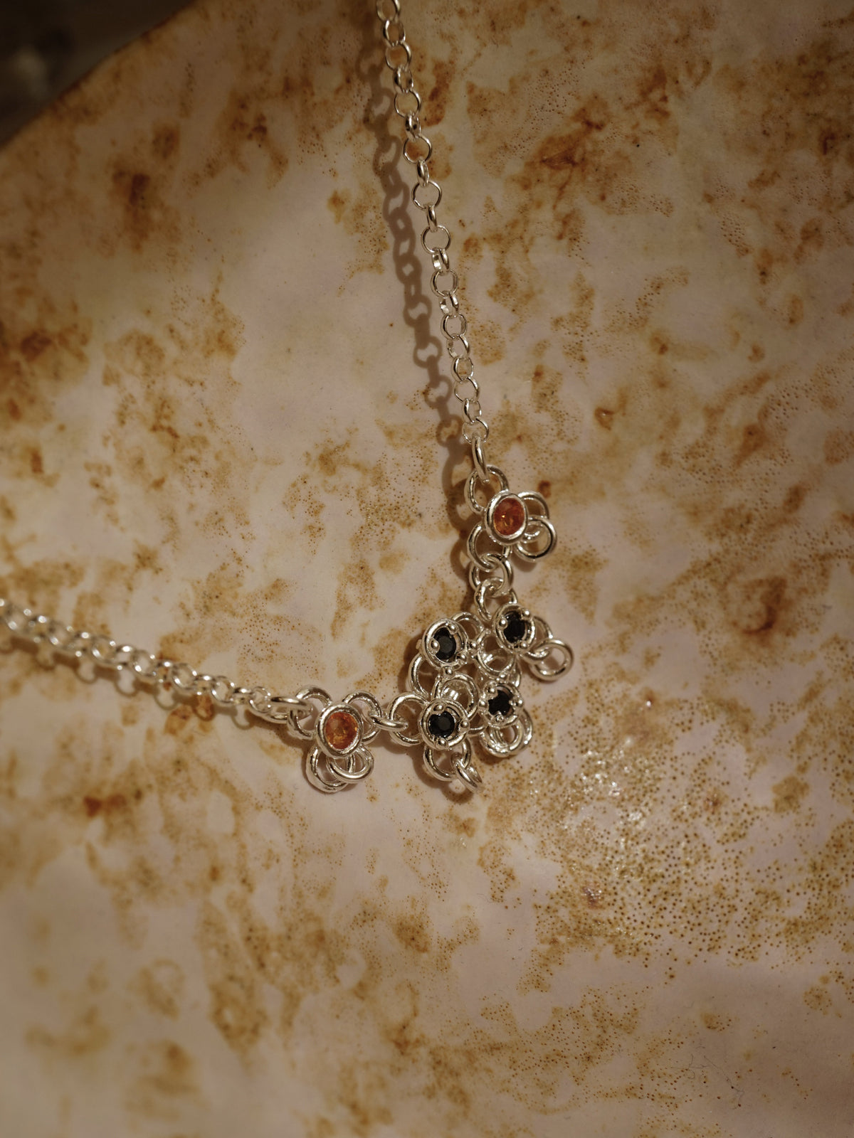sterling silver TRAME necklace with blue and orange sapphires