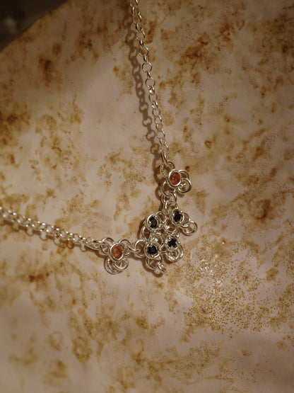 sterling silver TRAME necklace with blue and orange sapphires