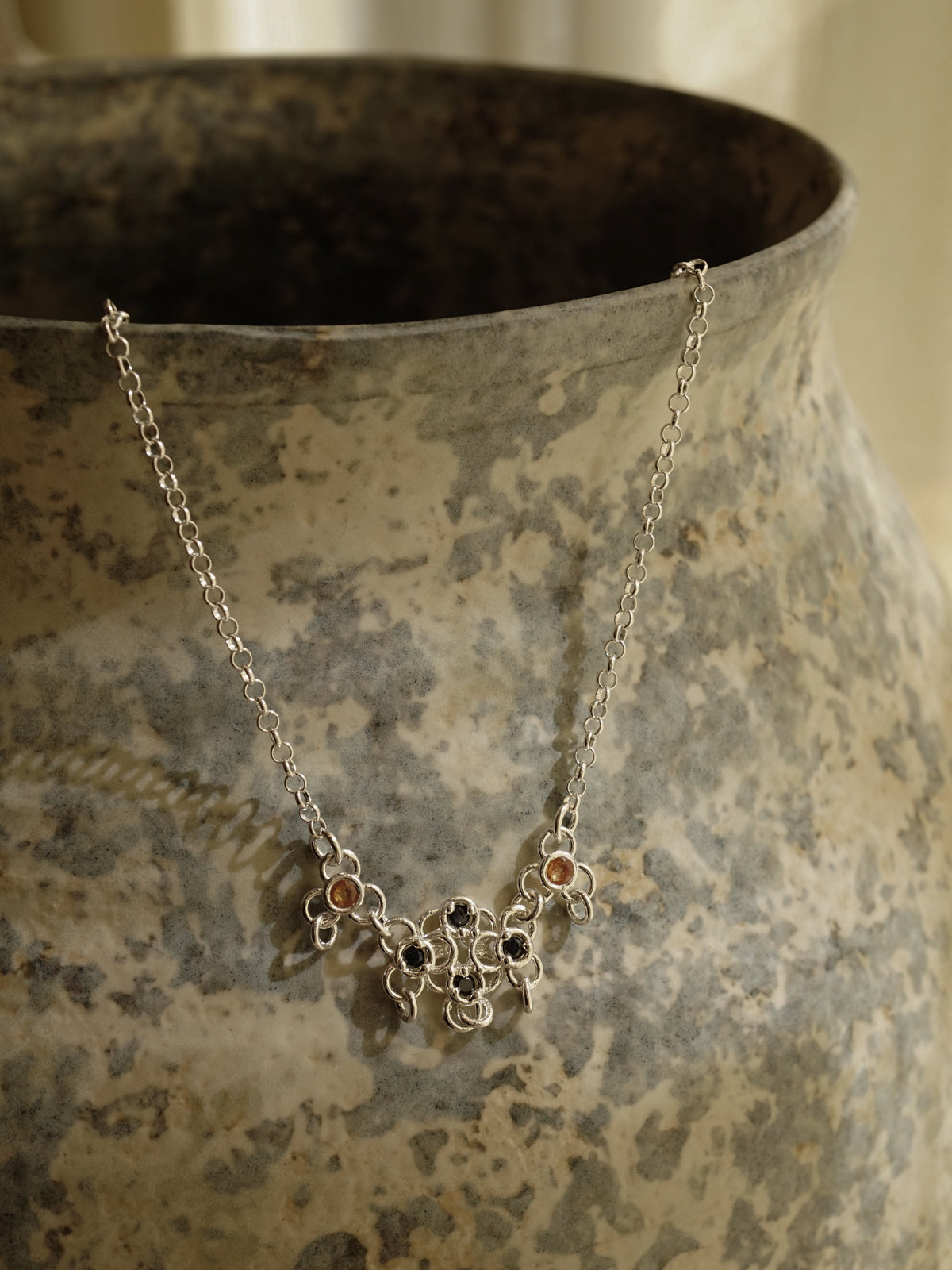 sterling silver TRAME necklace with blue and orange sapphires