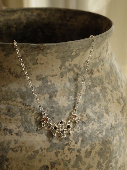 sterling silver TRAME necklace with blue and orange sapphires