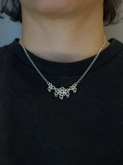 sterling silver TRAME necklace with blue and orange sapphires